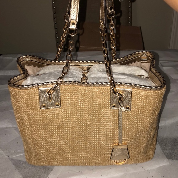 Micheal Kors leather and straw woven satchel.